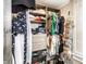 Organized walk-in closet features built-in shelves, drawers, hanging rods, and shoe storage for optimal space utilization at 421 S East St, Plainfield, IN 46168
