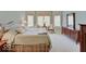 Spacious bedroom with a king-size bed, sitting area, and a large dresser at 443 Mclaren Ln, Carmel, IN 46032