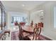 Open-concept dining area with a spacious view of the living space and bright white walls at 443 Mclaren Ln, Carmel, IN 46032