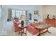 Bright living room featuring a fireplace, large windows, and comfortable seating at 443 Mclaren Ln, Carmel, IN 46032