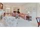 Open-concept living room with neutral tones, fireplace, and views into the dining area at 443 Mclaren Ln, Carmel, IN 46032