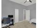 Bedroom with ceiling fan and desk area with office chair provides a workspace at 46 N Denny St, Indianapolis, IN 46201
