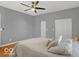 Bedroom with wood floors, ceiling fan, and double door closet at 46 N Denny St, Indianapolis, IN 46201