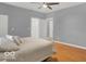 Bedroom featuring hardwood floors, and ensuite bathroom at 46 N Denny St, Indianapolis, IN 46201