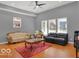 Cozy living room with high ceiling, hardwood floors, and comfortable seating at 46 N Denny St, Indianapolis, IN 46201