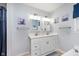 Charming bathroom featuring double sinks, modern fixtures, ceramic floors, and lots of light at 516 Hanover Dr, Anderson, IN 46012