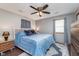 This bedroom boasts new fixtures, a modern ceiling fan, and a large window for plenty of natural light at 516 Hanover Dr, Anderson, IN 46012