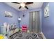 This bedroom has a modern ceiling fan, plenty of natural light, and fresh paint at 516 Hanover Dr, Anderson, IN 46012