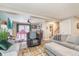 Comfortable living room features hardwood floors, ample seating, a fireplace, and plenty of natural light at 516 Hanover Dr, Anderson, IN 46012