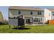 Spacious backyard with a patio, seating area, shed and well-manicured lawn at 5387 Crowley Pkwy, Whitestown, IN 46075