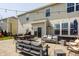 Spacious backyard with patio, multiple seating areas, and outdoor dining offers ideal space for gatherings at 5387 Crowley Pkwy, Whitestown, IN 46075