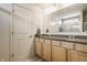 Bathroom with dual sinks, granite countertop, ample cabinet space, and a clear view of the shower at 5387 Crowley Pkwy, Whitestown, IN 46075