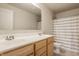 Bright bathroom featuring a double sink vanity with modern fixtures and a shower with striped curtain at 5387 Crowley Pkwy, Whitestown, IN 46075