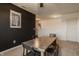 Dining area featuring a modern table with chairs, dark accent wall, and stylish lighting at 5387 Crowley Pkwy, Whitestown, IN 46075