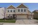 Charming two-story home featuring a two-car garage and basketball hoop on a sunny day at 5387 Crowley Pkwy, Whitestown, IN 46075
