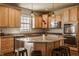 Spacious kitchen with granite counters, stainless appliances, wood cabinets and a center island at 5387 Crowley Pkwy, Whitestown, IN 46075