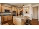 Well-equipped kitchen featuring a large island with granite counters, stainless appliances and wood cabinetry at 5387 Crowley Pkwy, Whitestown, IN 46075