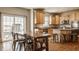 Bright eat-in kitchen with stainless appliances, granite counters, and wood cabinets at 5387 Crowley Pkwy, Whitestown, IN 46075