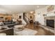 Spacious open-concept living area with fireplace, hardwood floors, and comfortable seating at 5387 Crowley Pkwy, Whitestown, IN 46075