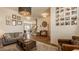 Inviting living room features hardwood floors, stylish decor, and comfortable seating, creating a warm and welcoming atmosphere at 5387 Crowley Pkwy, Whitestown, IN 46075