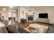 Comfortable living space with a stone fireplace, modern decor, and plenty of seating at 5387 Crowley Pkwy, Whitestown, IN 46075