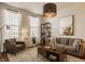 Cozy living room featuring neutral-toned walls and warm wood accents, providing a comfortable and stylish atmosphere at 5387 Crowley Pkwy, Whitestown, IN 46075