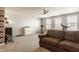 Large recreation room with a comfortable couch, exercise equipment, and plenty of space for activities at 5387 Crowley Pkwy, Whitestown, IN 46075