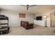 Well-lit recreation room featuring a treadmill, mounted TV, comfortable sofa, and neutral-toned carpet at 5387 Crowley Pkwy, Whitestown, IN 46075