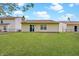 Backyard with a well-maintained lawn and houses in the background at 5541 Fair Ridge Pl, Indianapolis, IN 46221
