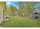 Large backyard featuring lush green lawn and a playset near the home at 5541 Fair Ridge Pl, Indianapolis, IN 46221