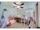 Bright bedroom with a ceiling fan, toys, and lofted bed at 5541 Fair Ridge Pl, Indianapolis, IN 46221