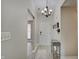 Foyer with modern floors, stylish lighting, and coat rack at 5541 Fair Ridge Pl, Indianapolis, IN 46221