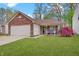 Charming single-story home with a brick facade, attached garage, and well-maintained front lawn at 5541 Fair Ridge Pl, Indianapolis, IN 46221