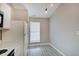 Bright kitchen area featuring modern floors and ample natural light from the window at 5541 Fair Ridge Pl, Indianapolis, IN 46221