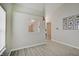 Bright living room showing the window, entrance, and view to the kitchen through cut-out at 5541 Fair Ridge Pl, Indianapolis, IN 46221