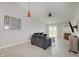 Bright living room boasts modern floors, high ceilings, fireplace, and ample natural light at 5541 Fair Ridge Pl, Indianapolis, IN 46221