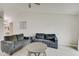 Open-concept living room features modern flooring, neutral walls, and comfortable seating at 5541 Fair Ridge Pl, Indianapolis, IN 46221