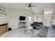 Cozy living room with a fireplace, modern floors, and comfortable seating at 5541 Fair Ridge Pl, Indianapolis, IN 46221