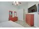 Spacious main bedroom features modern flooring, neutral walls, ceiling fan, and ample dresser space at 5541 Fair Ridge Pl, Indianapolis, IN 46221