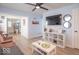 Bright living room with modern ceiling fan, updated floors and neutral walls at 555 Leeds Ave, Indianapolis, IN 46203