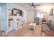 Bright living room with modern ceiling fan, updated floors and neutral walls at 555 Leeds Ave, Indianapolis, IN 46203
