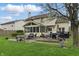 Lovely backyard featuring a patio with seating and a cozy screened-in porch at 5710 Dapple Trce, Indianapolis, IN 46228