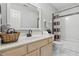Neutral bathroom with a tub and shower featuring elegant tile accents and modern vanity at 5710 Dapple Trce, Indianapolis, IN 46228