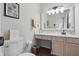 Bathroom with neutral tones, modern fixtures, decorative accents, and under-sink storage at 5710 Dapple Trce, Indianapolis, IN 46228