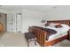 Relaxing bedroom with neutral carpet, a wooden bed frame, and white walls for a comfy space at 5710 Dapple Trce, Indianapolis, IN 46228