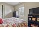 Charming bedroom has neutral walls, carpet, and a window that provides lots of natural light at 5710 Dapple Trce, Indianapolis, IN 46228