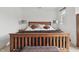 Lovely bedroom featuring a wooden bed frame, bench, and neutral carpet that offers a cozy retreat at 5710 Dapple Trce, Indianapolis, IN 46228