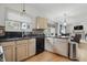 Cozy kitchen featuring stainless steel appliances, mosaic backsplash, and a convenient open floorplan design at 5710 Dapple Trce, Indianapolis, IN 46228