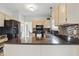 Bright kitchen boasting granite countertops, stainless steel appliances, and ample cabinetry for storage at 5710 Dapple Trce, Indianapolis, IN 46228