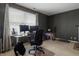 Bright, functional office with two monitors, a desk, and comfortable chair bathed in sunlight at 5710 Dapple Trce, Indianapolis, IN 46228